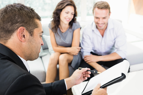 advisor talking with a couple
